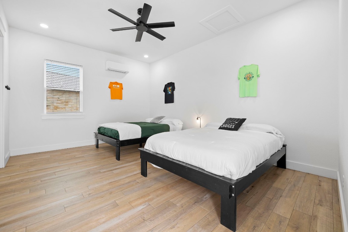 1463 Mountain Valley Road Concan, TX 78838 - Photo 23 of 43 a bedroom with a bed and window