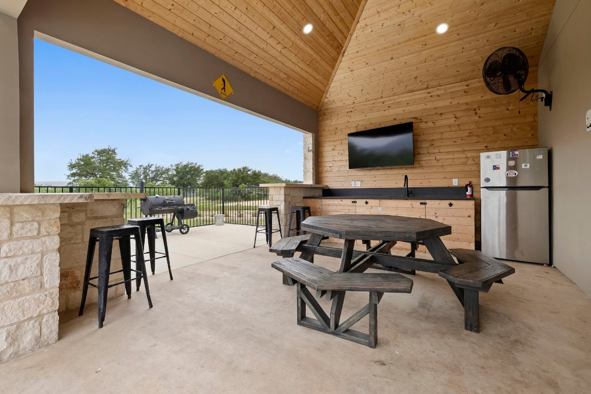 1463 Mountain Valley Road Concan, TX 78838 - Photo 29 of 43 a patio with table and chairs