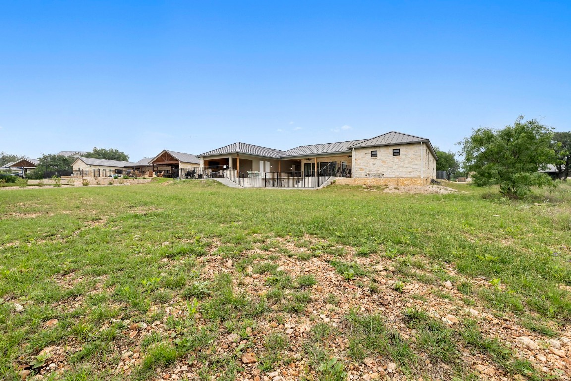 1463 Mountain Valley Road Concan, TX 78838 - Photo 38 of 43 a house view with a garden space