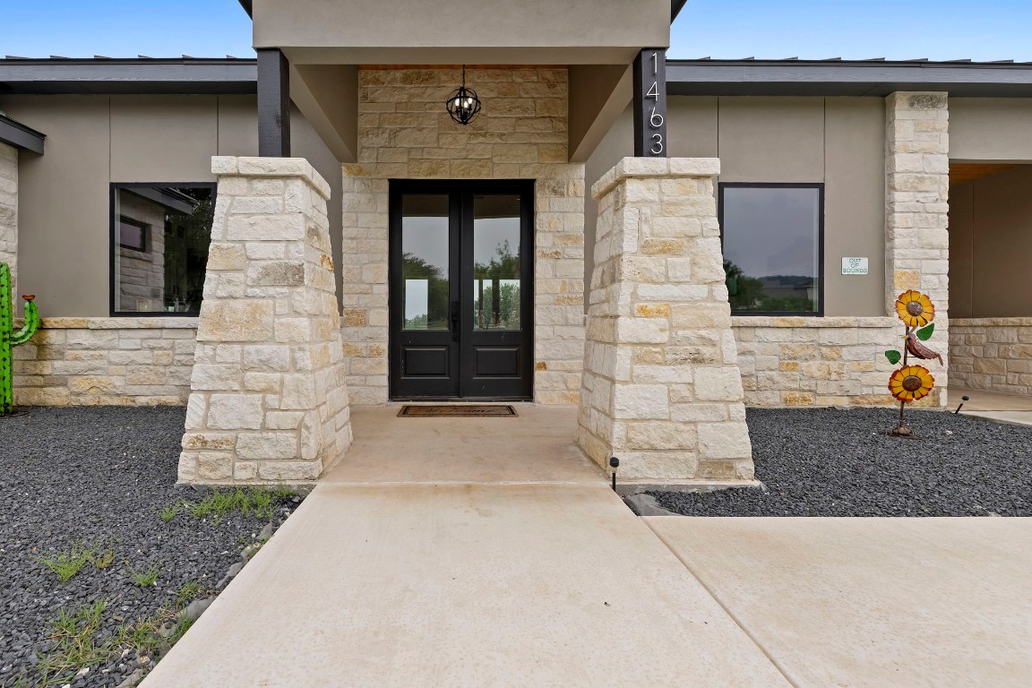 1463 Mountain Valley Road Concan, TX 78838 - Photo 4 of 43 a front view of a house with a yard