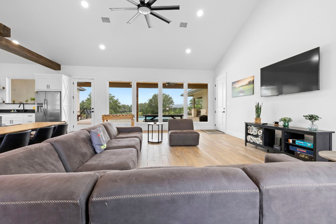 1463 Mountain Valley Road Concan, TX 78838 - Photo 7 of 43 a living room with furniture and a flat screen tv