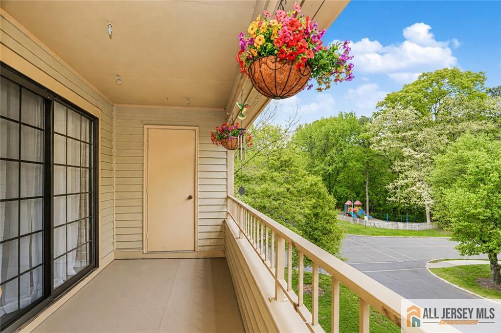 612 Chester Court Helmetta, NJ 08828 - Photo 22 of 31 a view of a balcony with flower plants