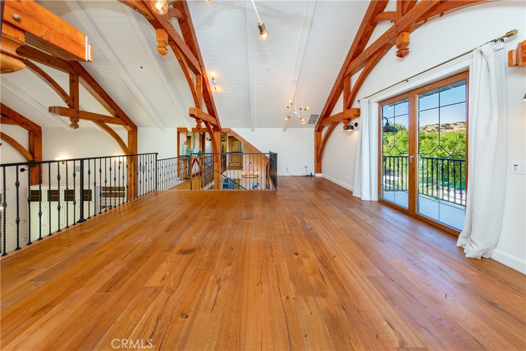 85 Saddlebow Road Bell Canyon, CA 91307 - Photo 33 of 75 a view of staircase with a floor to ceiling window and wooden floor