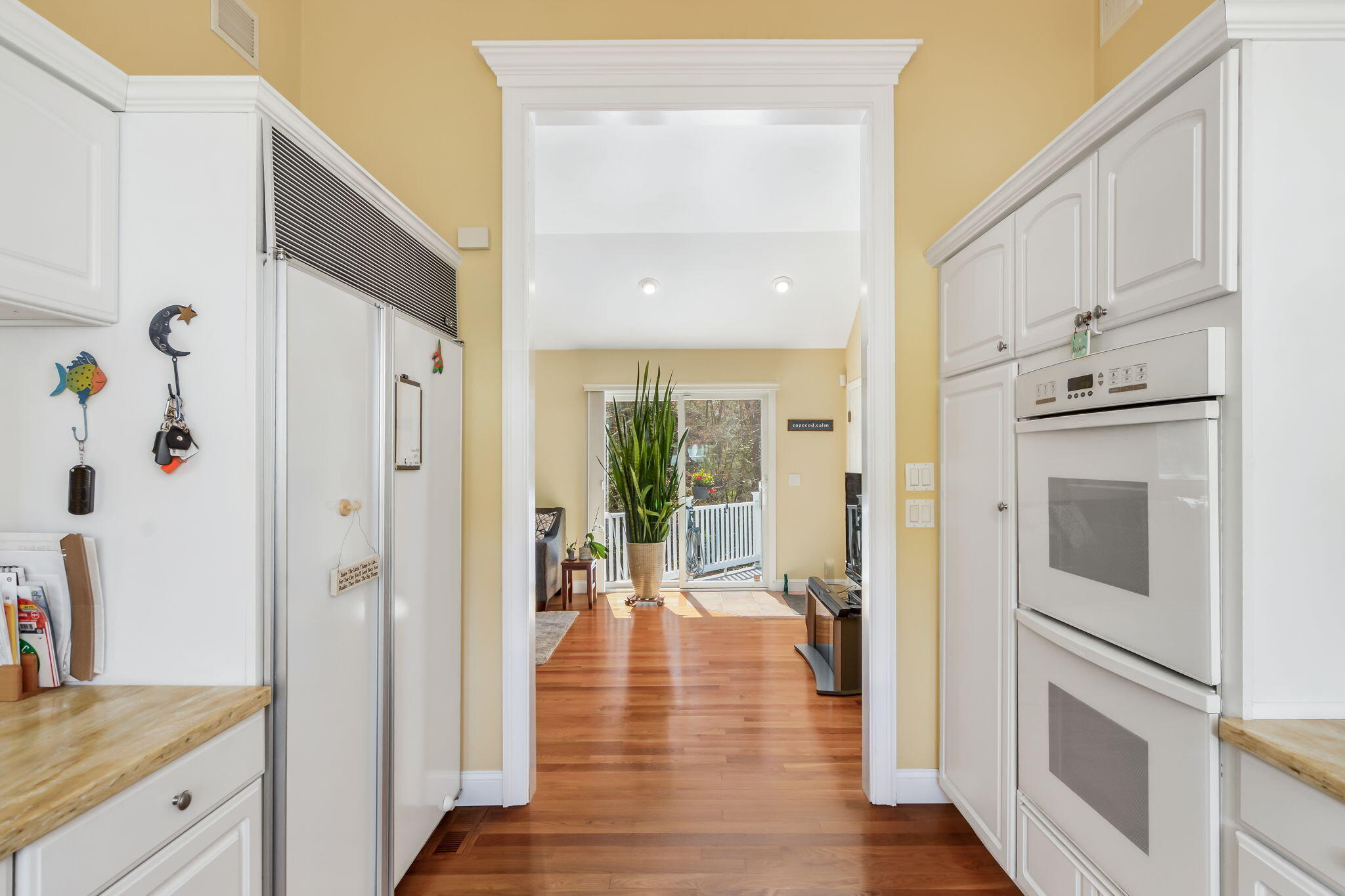 240 Surf Drive Mashpee, MA 02649 - Photo 12 of 37 a view of kitchen with furniture and wooden floor