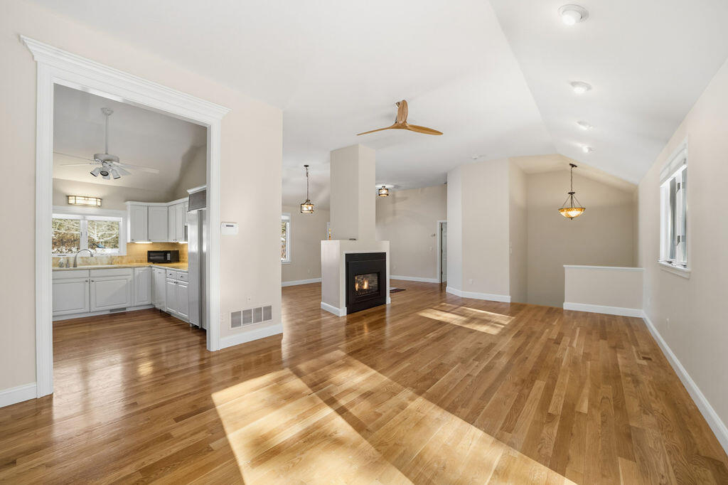 240 Surf Drive Mashpee, MA 02649 - Photo 13 of 45 Living room showing jkitchen, gas firepl