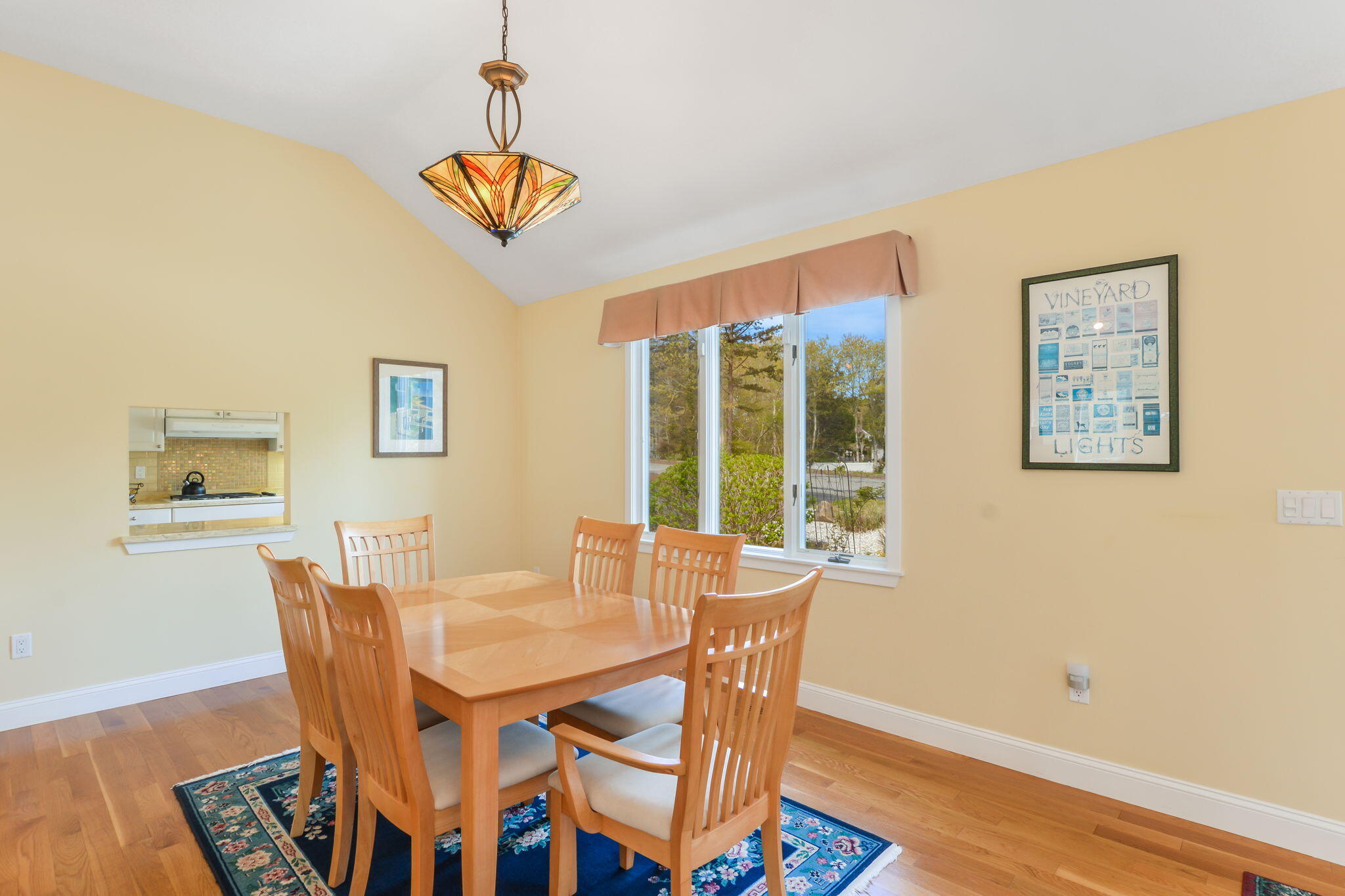 240 Surf Drive Mashpee, MA 02649 - Photo 14 of 37 a dining room with furniture a window and wooden floor