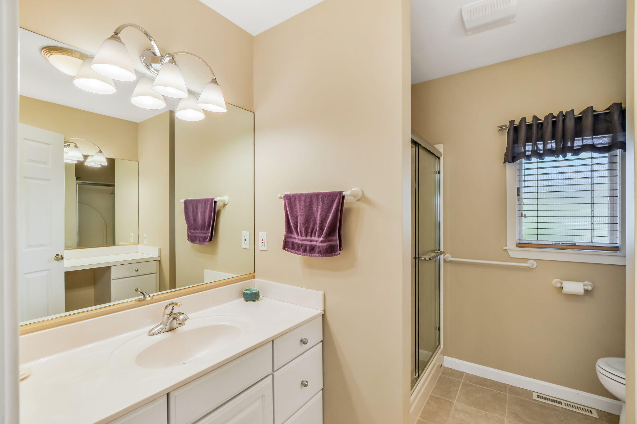 240 Surf Drive Mashpee, MA 02649 - Photo 18 of 37 a bathroom with a sink vanity and a mirror