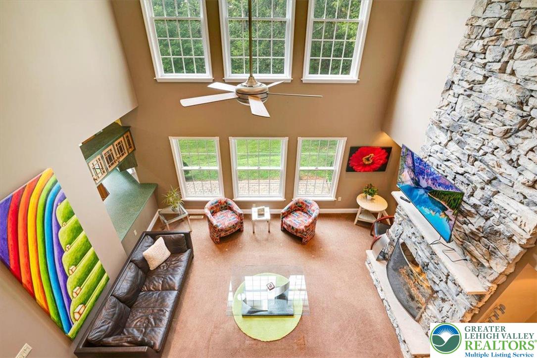 1488 Kelly Road Stroudsburg, PA 18360 - Photo 17 of 89 a view of a room with furniture and a floor to ceiling window