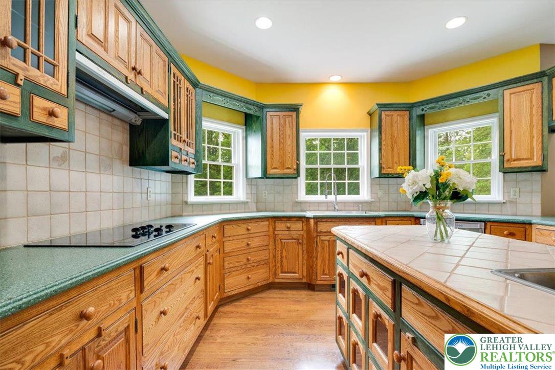 1488 Kelly Road Stroudsburg, PA 18360 - Photo 19 of 89 a kitchen with granite countertop sink and cabinets