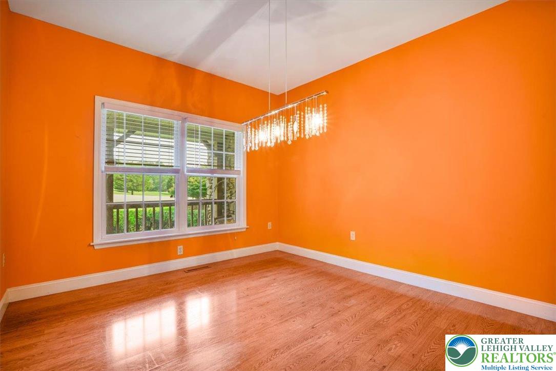 1488 Kelly Road Stroudsburg, PA 18360 - Photo 25 of 89 a view of an empty room with wooden floor and a window