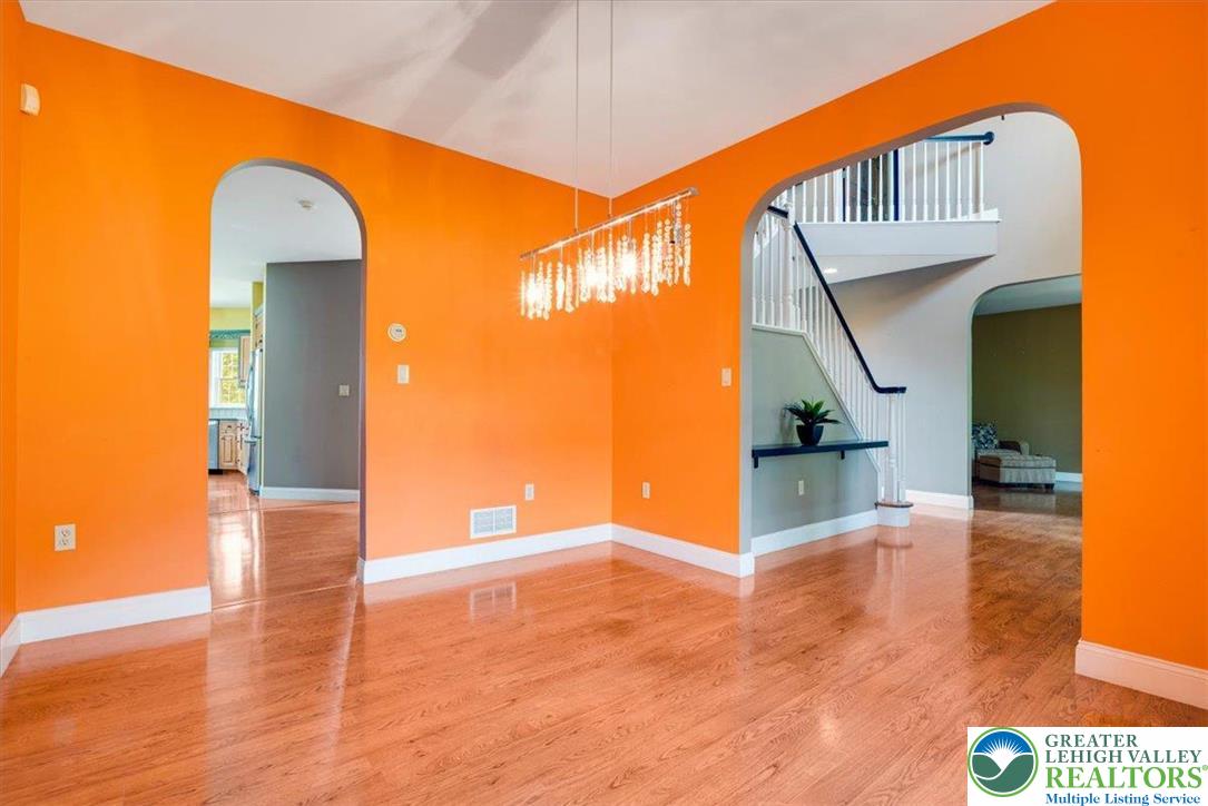 1488 Kelly Road Stroudsburg, PA 18360 - Photo 27 of 89 a view of a hallway to an empty room with wooden floor
