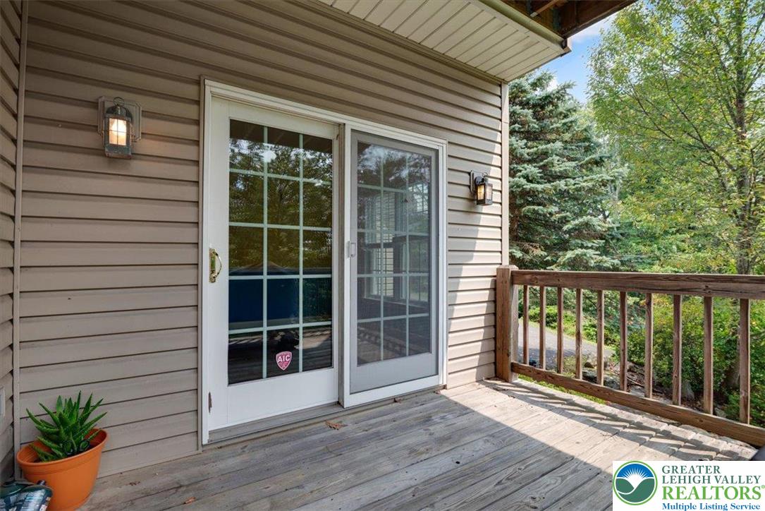 1488 Kelly Road Stroudsburg, PA 18360 - Photo 35 of 89 a view of a house with a large window and wooden floor