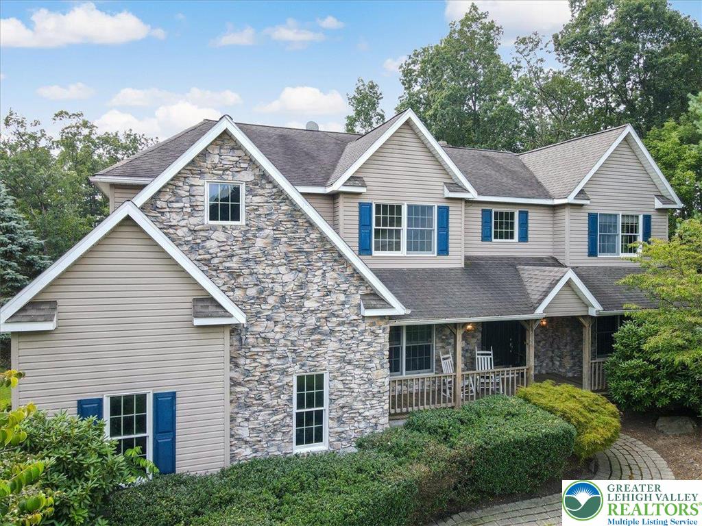 1488 Kelly Road Stroudsburg, PA 18360 - Photo 4 of 89 a front view of a house with a yard