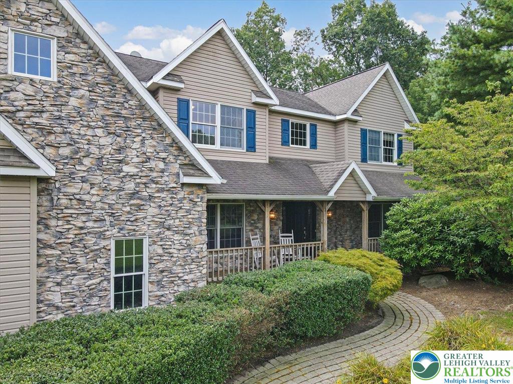 1488 Kelly Road Stroudsburg, PA 18360 - Photo 5 of 89 a front view of a house with garden