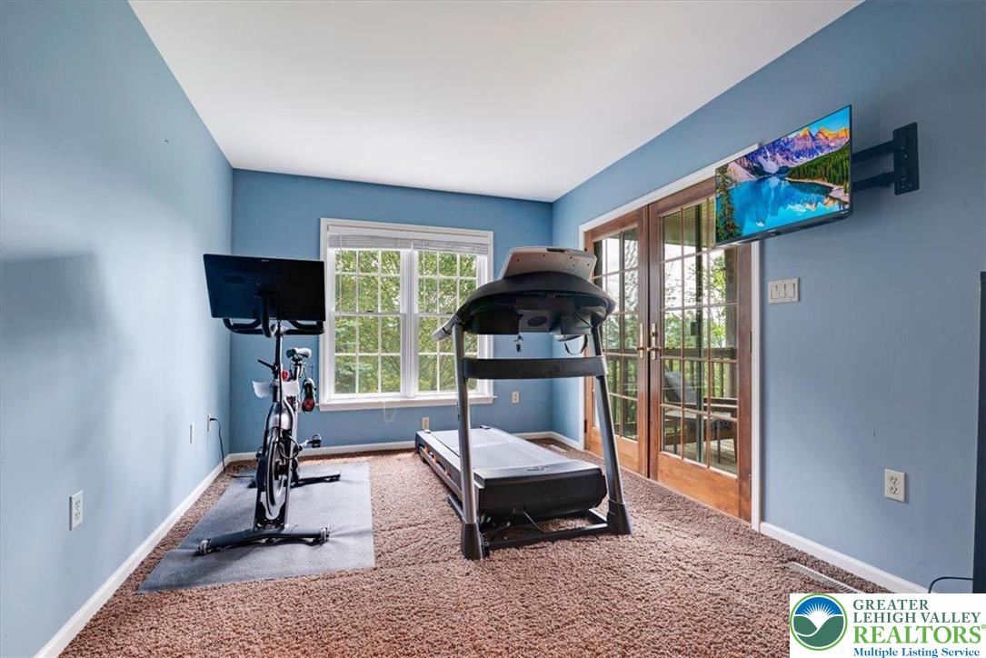 1488 Kelly Road Stroudsburg, PA 18360 - Photo 53 of 89 a living room with furniture and a flat screen tv