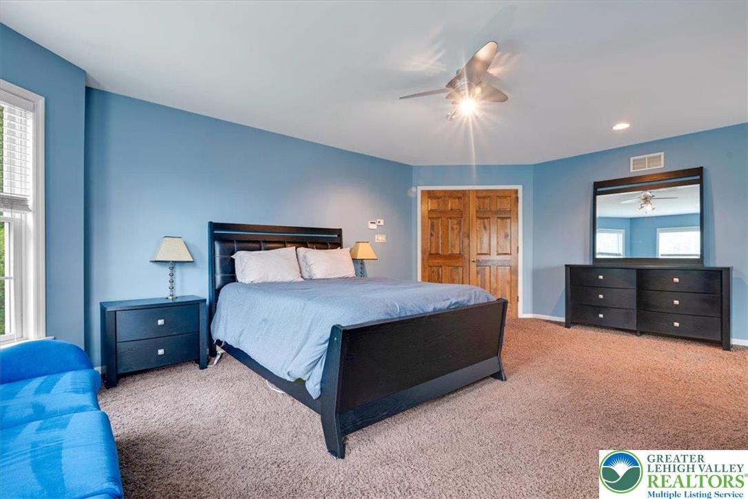 1488 Kelly Road Stroudsburg, PA 18360 - Photo 54 of 89 a bedroom with a bed and a dresser