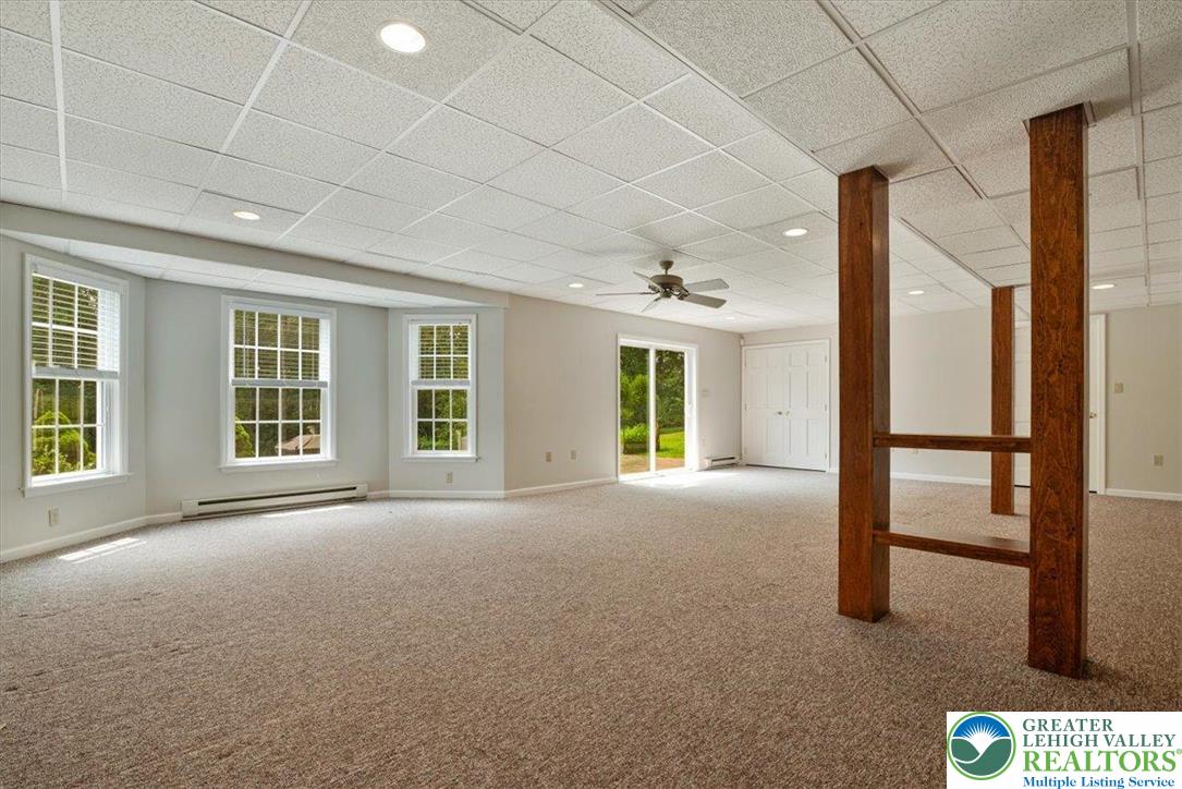 1488 Kelly Road Stroudsburg, PA 18360 - Photo 63 of 89 a view of a big room with windows and chandelier