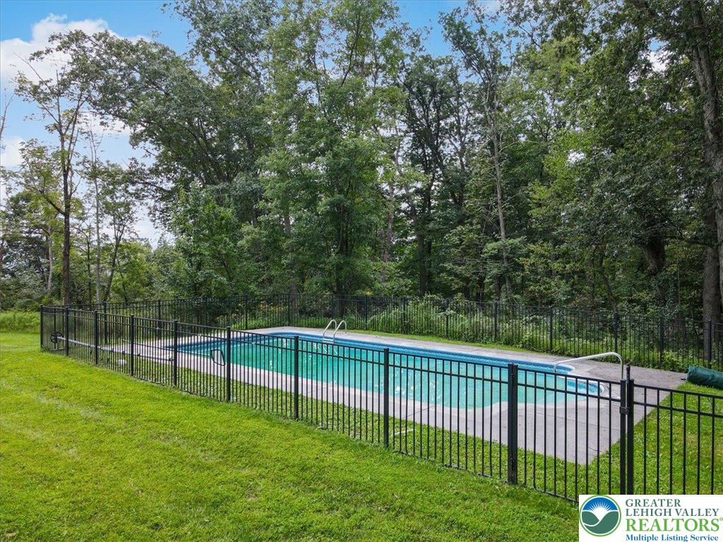 1488 Kelly Road Stroudsburg, PA 18360 - Photo 77 of 89 a view of a backyard with a wooden fence