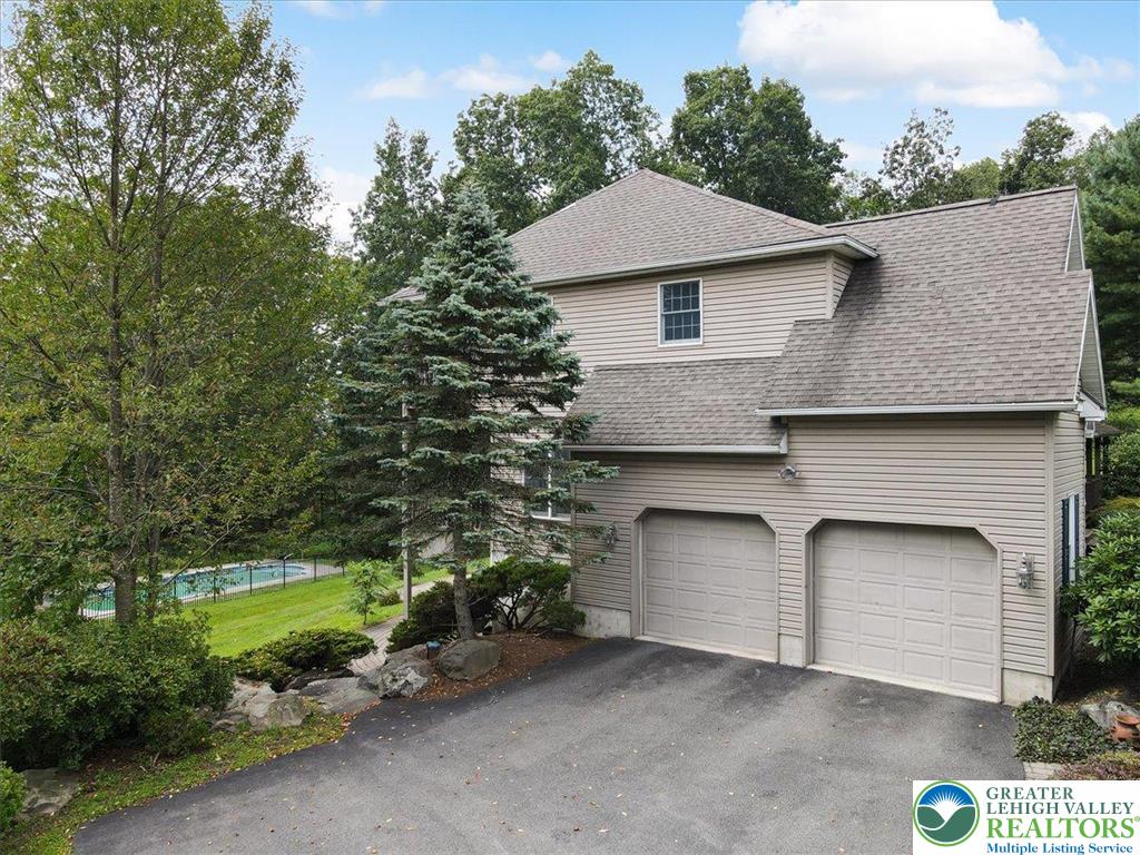 1488 Kelly Road Stroudsburg, PA 18360 - Photo 79 of 89 a aerial view of a house with a yard and garage
