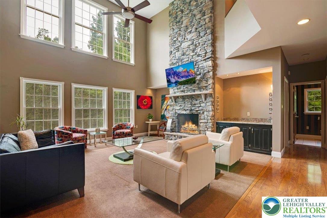 1488 Kelly Road Stroudsburg, PA 18360 - Photo 10 of 89 a living room with fireplace furniture and a large window