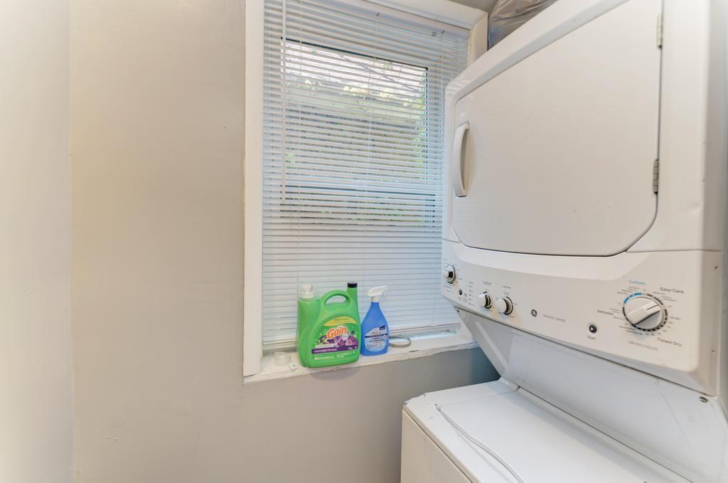 6840 South Prairie Avenue Chicago, IL 60637 - Photo 14 of 47 a bathroom with a toilet a sink and a window