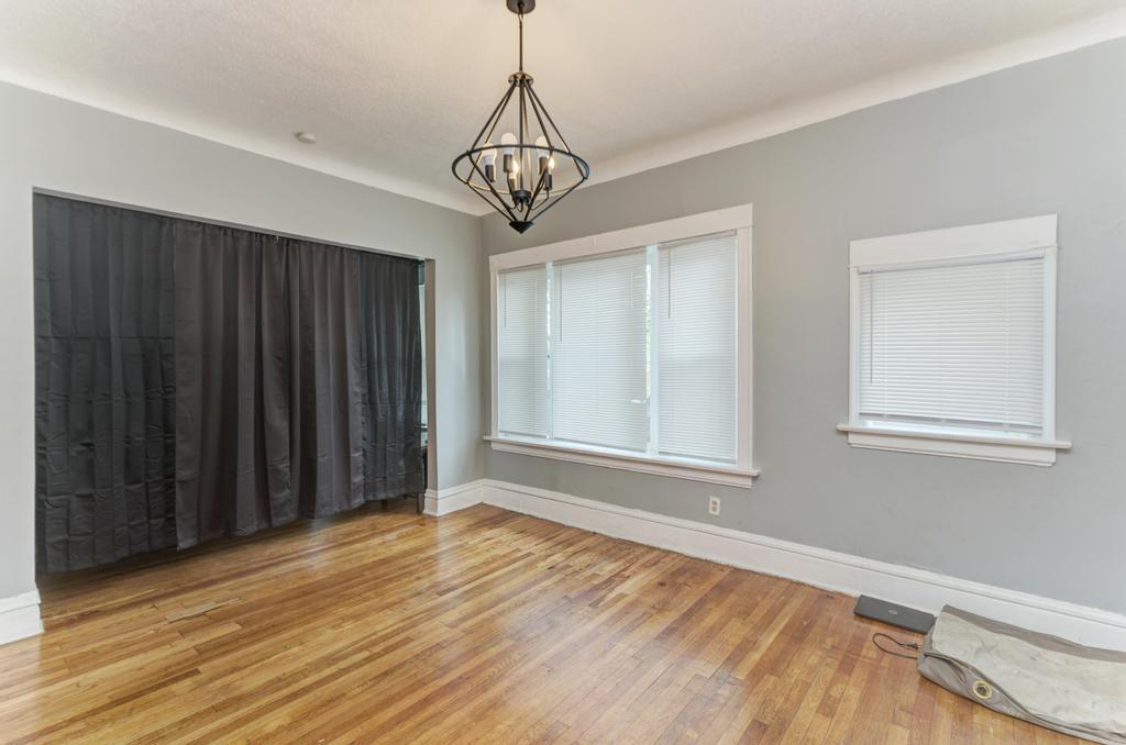 6840 South Prairie Avenue Chicago, IL 60637 - Photo 16 of 47 a view of a livingroom with wooden floor and windows