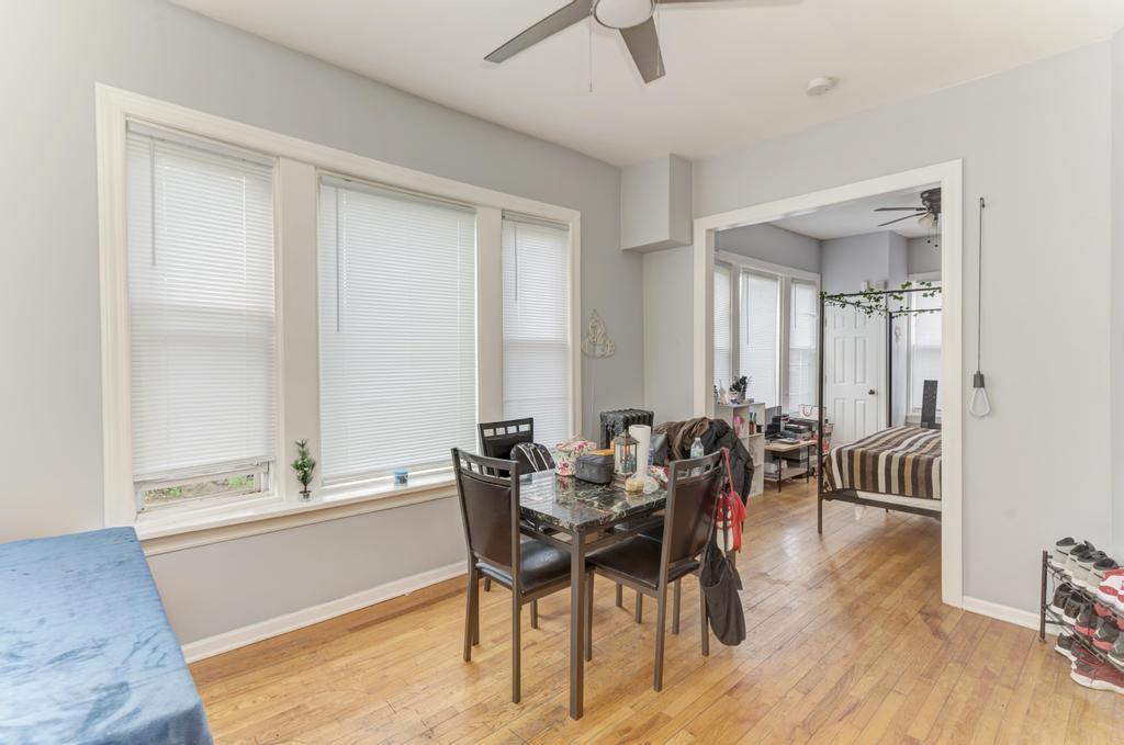 6840 South Prairie Avenue Chicago, IL 60637 - Photo 36 of 47 a dining room with furniture and wooden floor