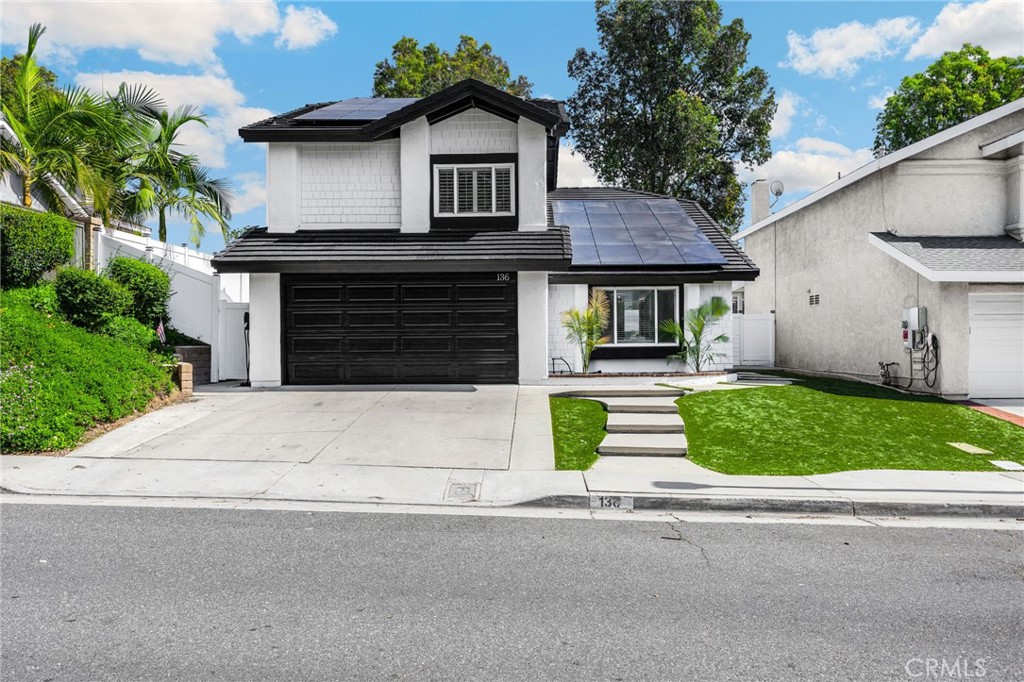 136 Donnybrook Road Brea, CA 92821 - Photo 1 of 1 a front view of a house with a garden and plants