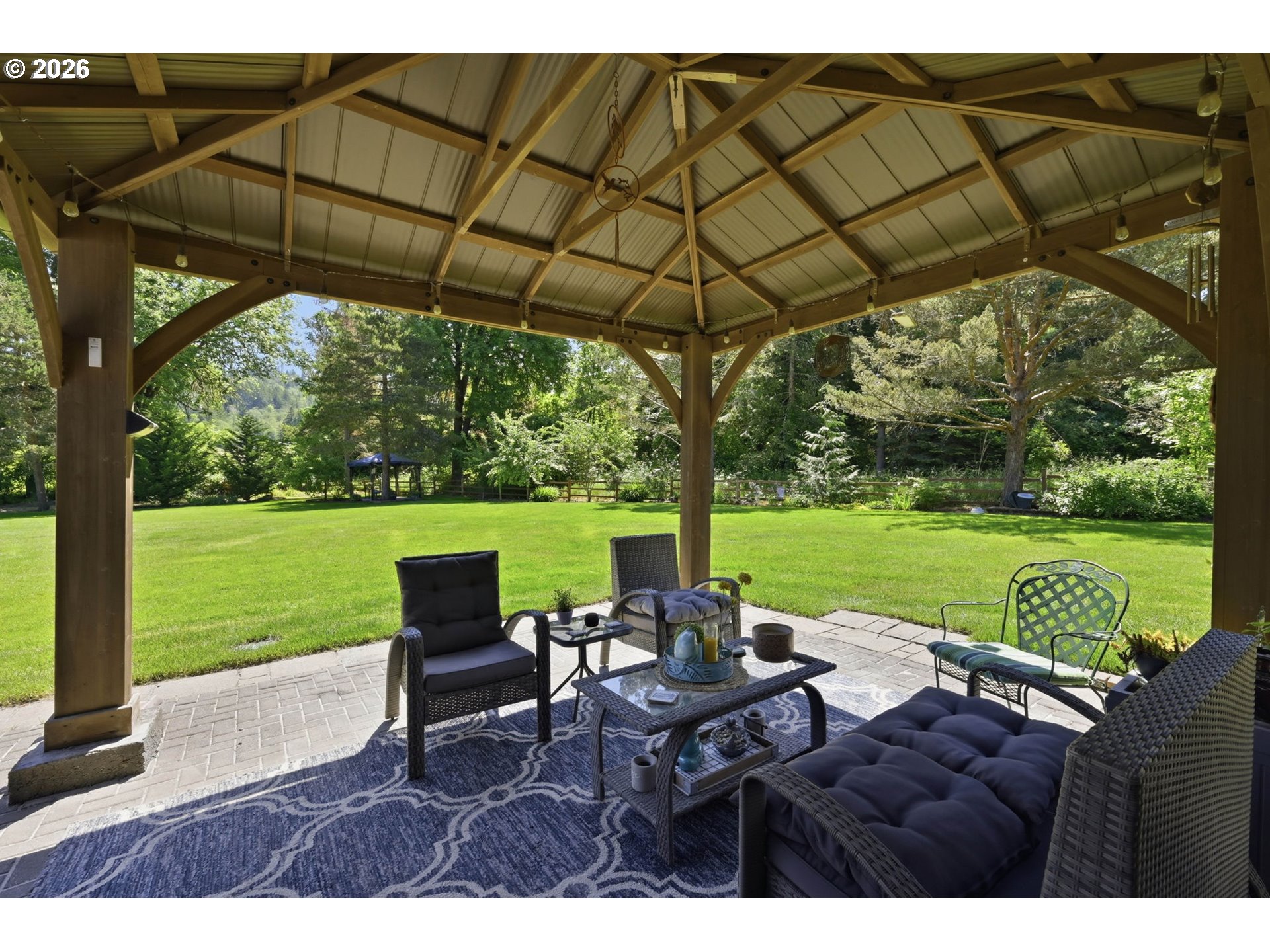 29778 Gimpl Hill Road Eugene, OR 97405 - Photo 32 of 43 a view of yard with seating space and trees in the background