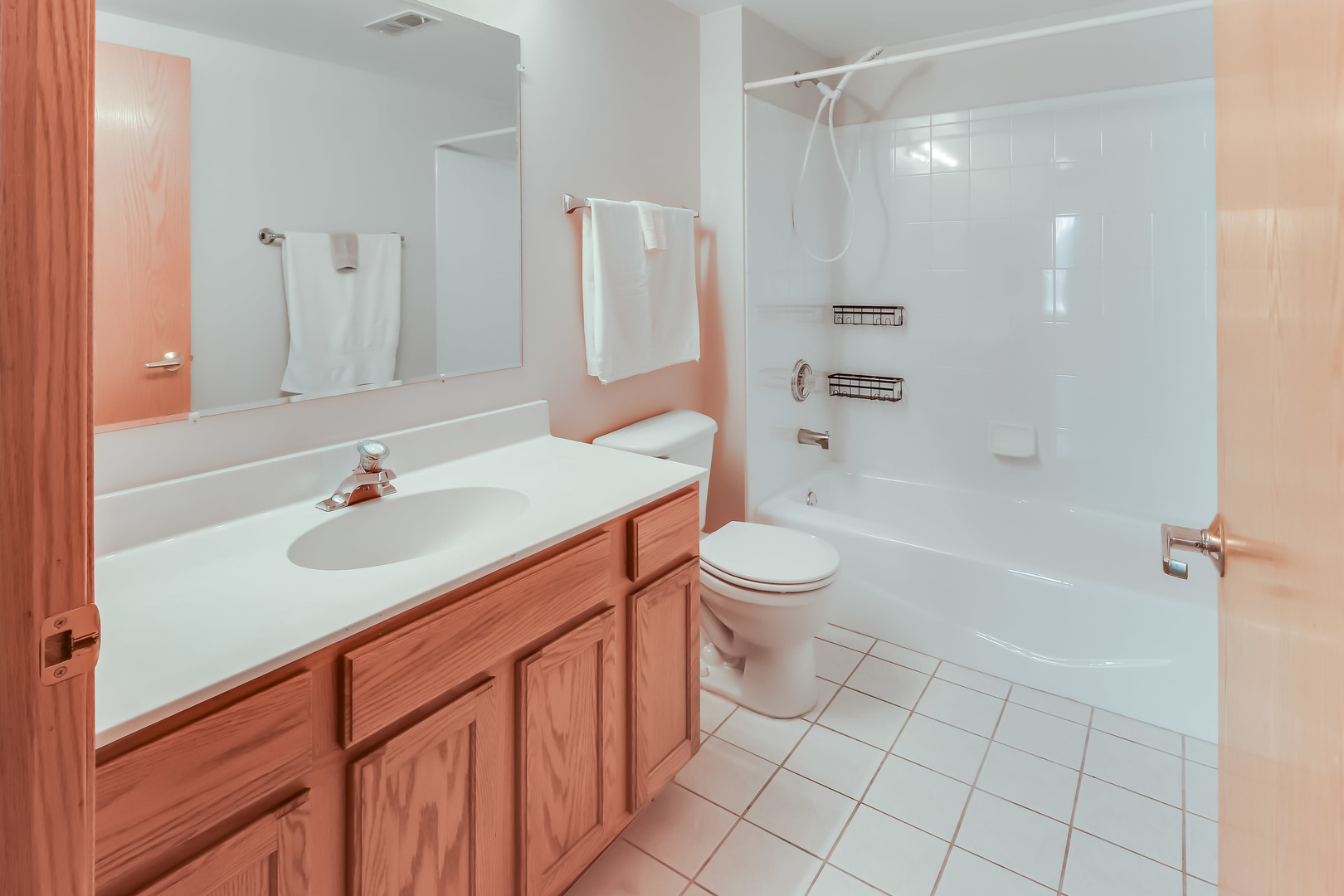 1200 South Prospect Avenue, Unit 303 Elmhurst, IL 60126 - Photo 11 of 21 a bathroom with a sink toilet double vanity and shower