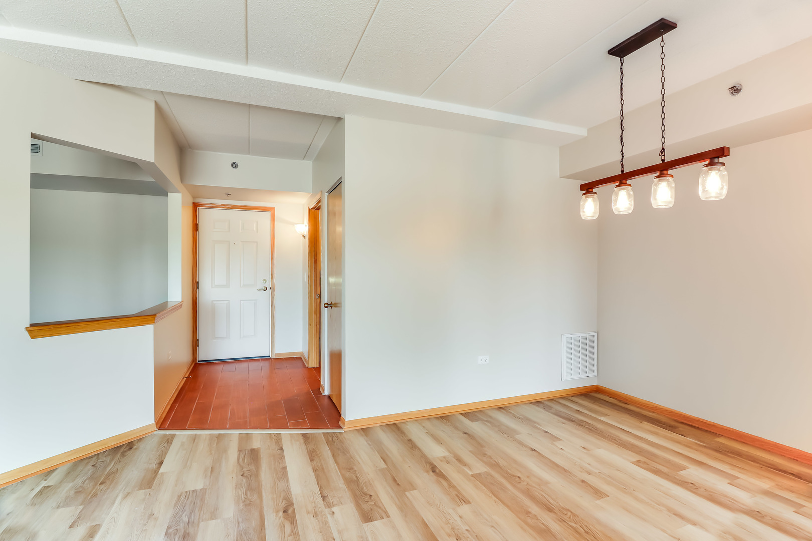 1200 South Prospect Avenue, Unit 303 Elmhurst, IL 60126 - Photo 3 of 21 a view of empty room with wooden floor and fan