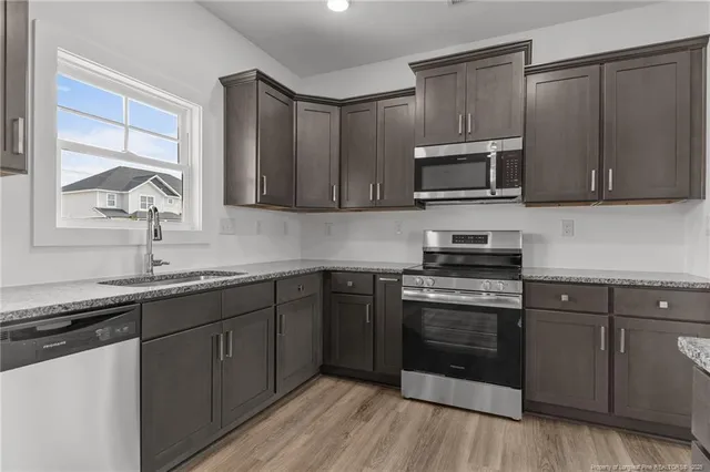 wooden floor in an empty room with a fireplace