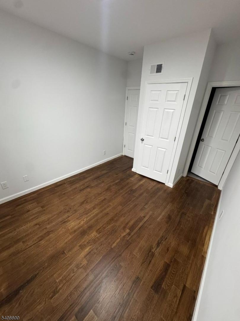 196 Malvern Street, Unit 3 Newark, NJ 07105 - Photo 11 of 16 a view of empty room with wooden floor