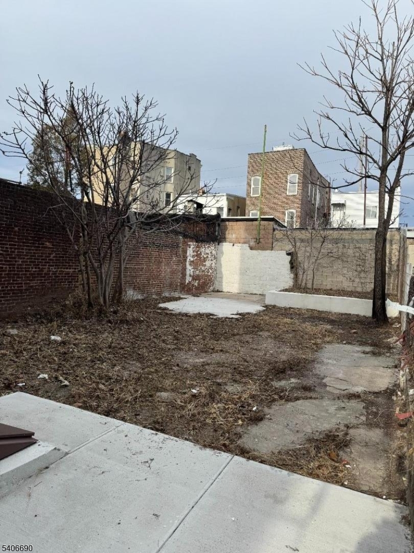 196 Malvern Street, Unit 3 Newark, NJ 07105 - Photo 14 of 16 a view of a yard with large trees