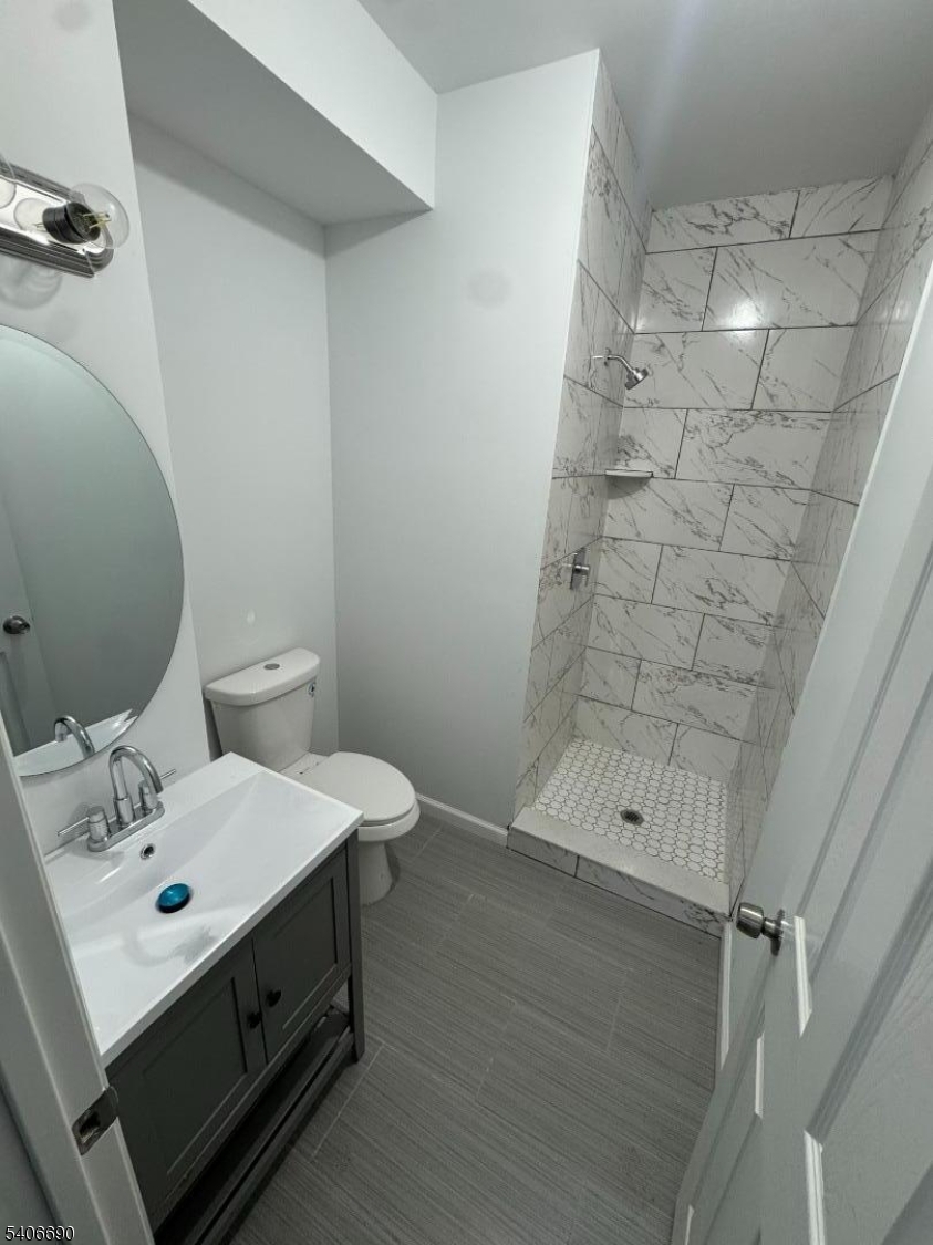 196 Malvern Street, Unit 3 Newark, NJ 07105 - Photo 10 of 16 a bathroom with a sink toilet and shower