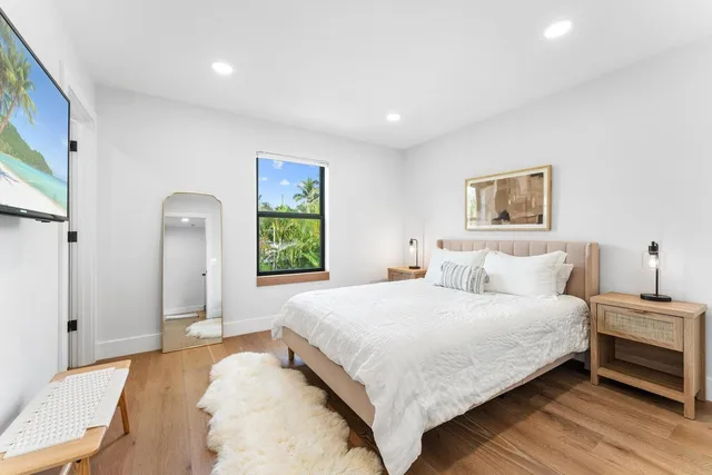 a bedroom with a bed and a walk in closet