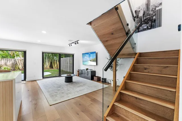 a view of entryway with wooden floor and stairs