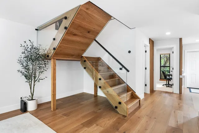 a dining room with furniture and wooden floor