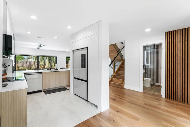 a kitchen with a sink cabinets and window
