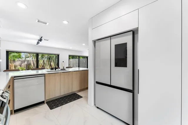 a kitchen with a stove a sink and a microwave