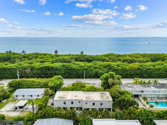 an aerial view of a house with a garden