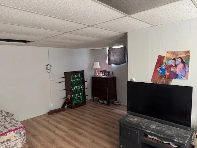 a bedroom with furniture and flat screen tv