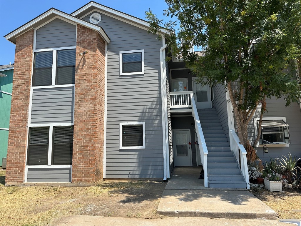 a front view of a house with a garage