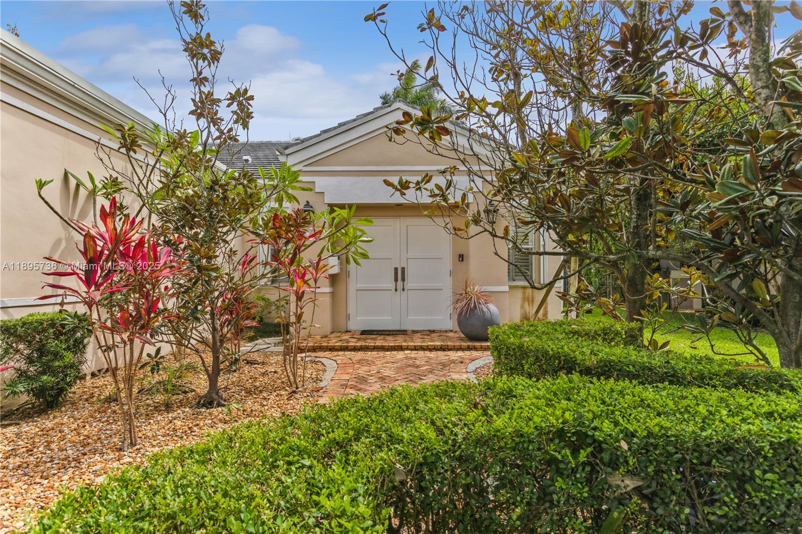 5774 Southwest 76th Terrace South Miami, FL 33143 - Photo 1 of 38 a front view of a house with a yard