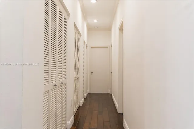 a view of a bathroom from a hallway