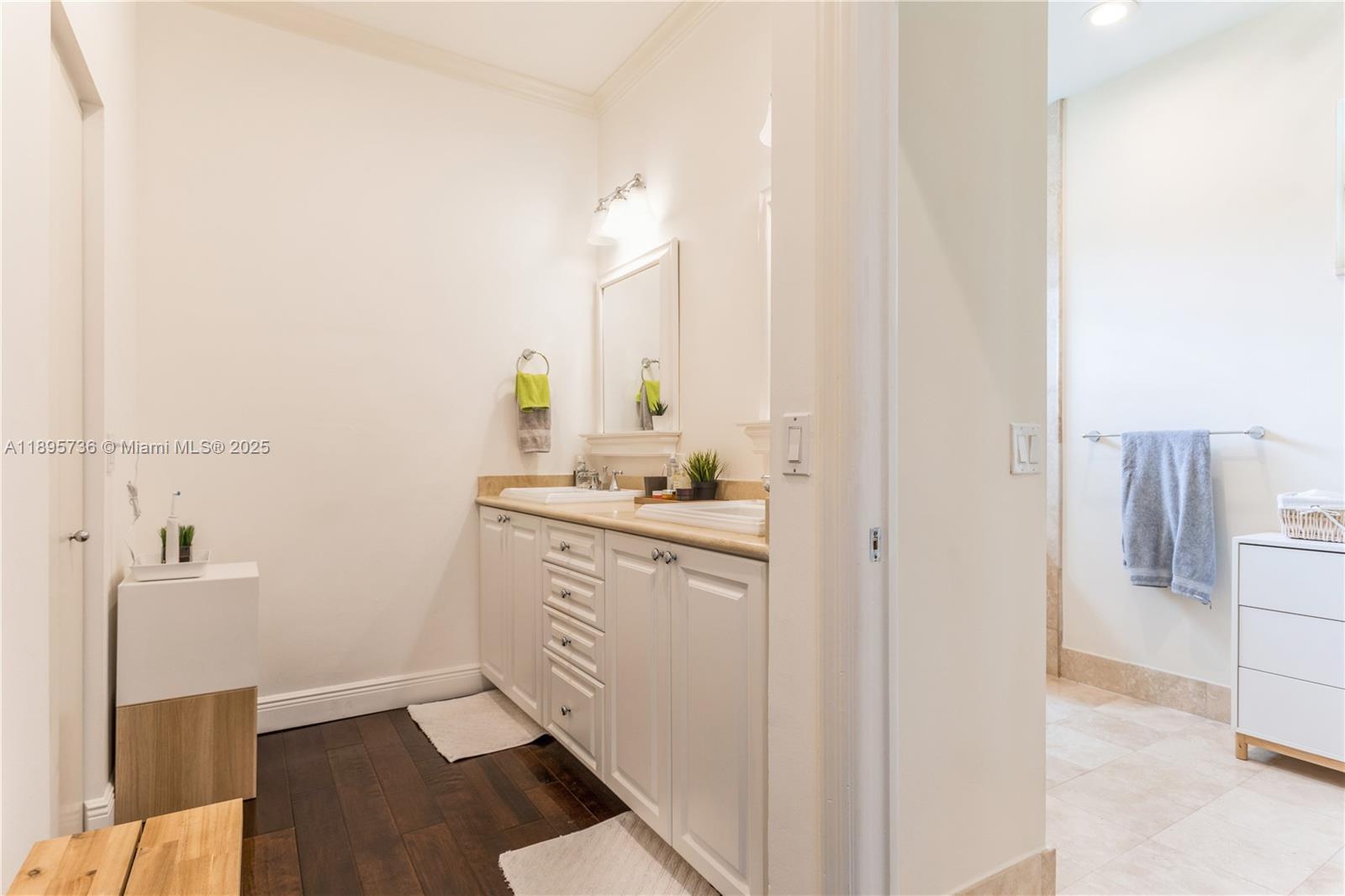 5774 Southwest 76th Terrace South Miami, FL 33143 - Photo 23 of 38 a bathroom with a sink and a mirror