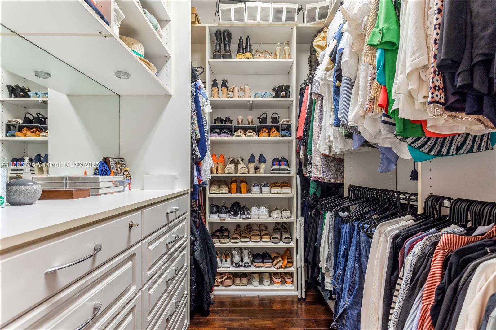5774 Southwest 76th Terrace South Miami, FL 33143 - Photo 28 of 38 a view of walk in closet with clothes and shoes
