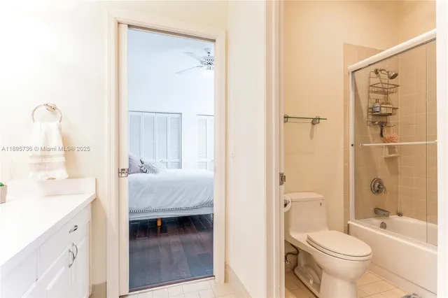 a en suite bathroom with a sink toilet and shower