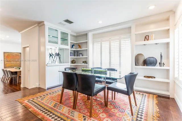 a work room with furniture and wooden floor