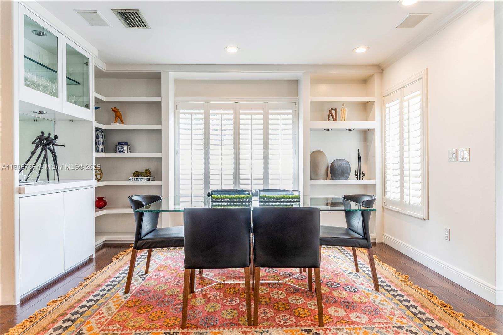 5774 Southwest 76th Terrace South Miami, FL 33143 - Photo 7 of 38 a view of a dining room with furniture window and wooden floor